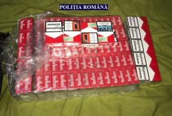 Peste 117.000 țigări de contrabandă găsite de polițiști în urma a două percheziții domiciliare